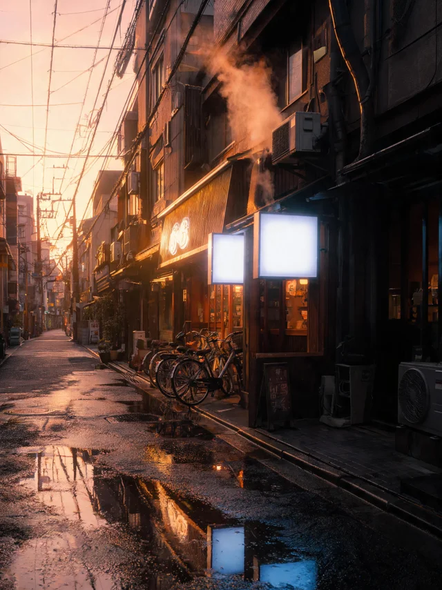 Seedream 5 Lite: Golden-hour Tokyo alley after rain, empty street with steam rising from a ramen shop vent,